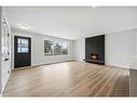 36 Maple Court Crescent Se, Calgary, AB  - Indoor Photo Showing Living Room With Fireplace 