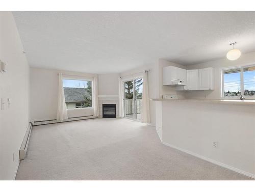 2301-20 Harvest Rose Park Ne, Calgary, AB - Indoor With Fireplace