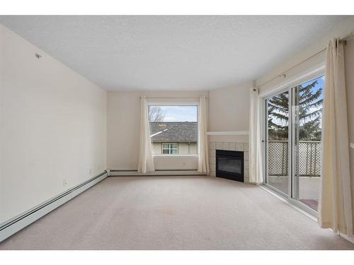 2301-20 Harvest Rose Park Ne, Calgary, AB - Indoor With Fireplace