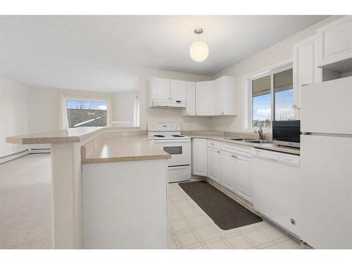 2301-20 Harvest Rose Park Ne, Calgary, AB - Indoor Photo Showing Kitchen With Double Sink