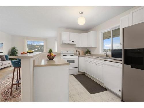 2301-20 Harvest Rose Park Ne, Calgary, AB - Indoor Photo Showing Kitchen With Double Sink