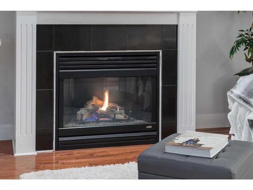 2-2811 24A Street Sw, Calgary, AB - Indoor Photo Showing Living Room With Fireplace