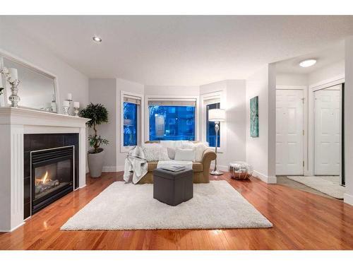 2-2811 24A Street Sw, Calgary, AB - Indoor Photo Showing Living Room With Fireplace