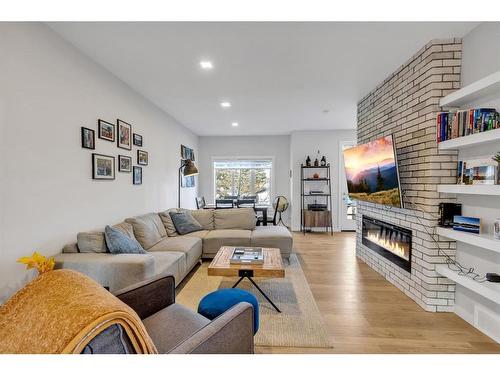 412 Greenbriar Common Nw, Calgary, AB - Indoor Photo Showing Living Room With Fireplace