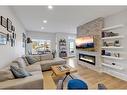 412 Greenbriar Common Nw, Calgary, AB  - Indoor Photo Showing Living Room With Fireplace 