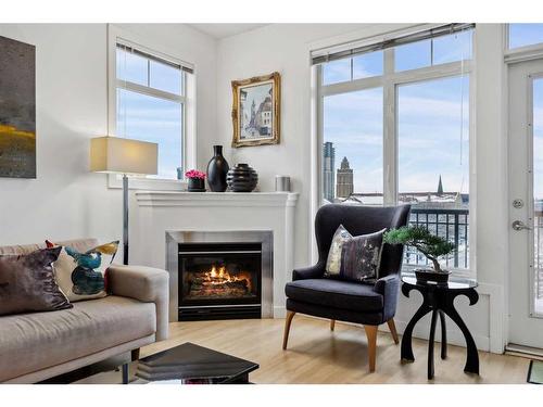 402-303 19 Avenue Sw, Calgary, AB - Indoor Photo Showing Living Room With Fireplace