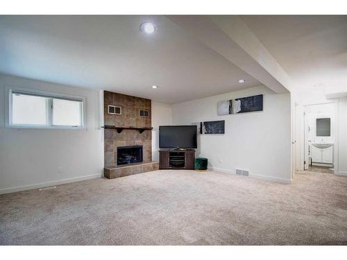 40 Strathearn Rise Sw, Calgary, AB - Indoor With Fireplace