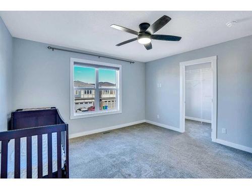 937 Midtown Avenue Sw, Airdrie, AB - Indoor Photo Showing Bedroom