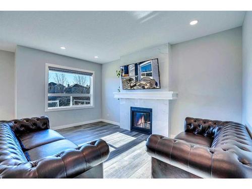 937 Midtown Avenue Sw, Airdrie, AB - Indoor Photo Showing Living Room With Fireplace