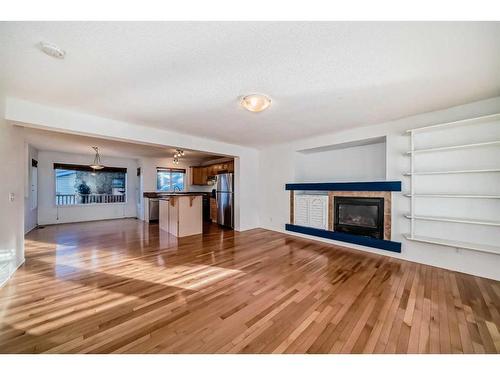 294 Everglen Rise Sw, Calgary, AB - Indoor Photo Showing Living Room With Fireplace