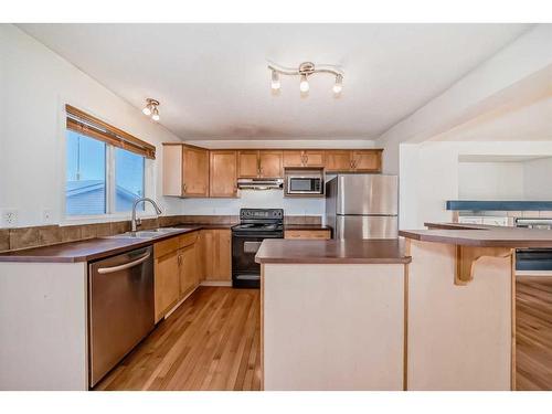 294 Everglen Rise Sw, Calgary, AB - Indoor Photo Showing Kitchen With Double Sink