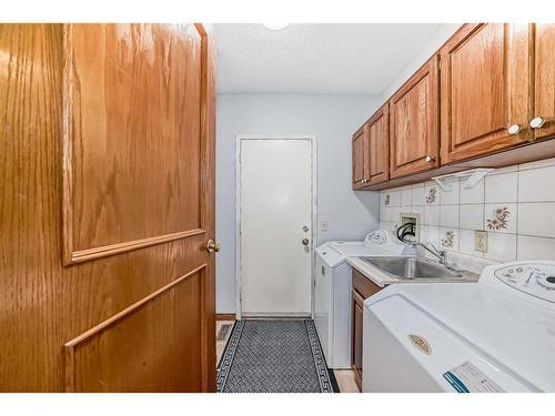 80 Suncastle Crescent Se, Calgary, AB - Indoor Photo Showing Laundry Room