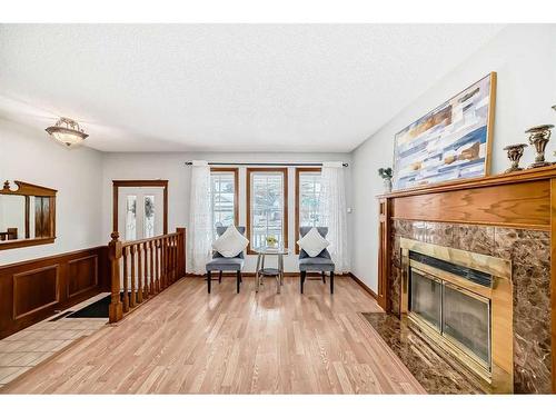 80 Suncastle Crescent Se, Calgary, AB - Indoor Photo Showing Living Room With Fireplace