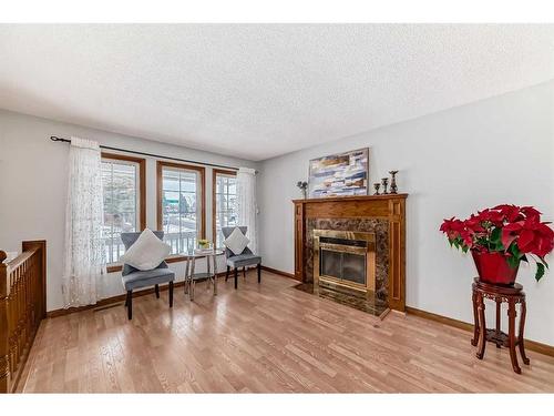 80 Suncastle Crescent Se, Calgary, AB - Indoor Photo Showing Living Room With Fireplace