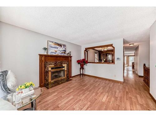 80 Suncastle Crescent Se, Calgary, AB - Indoor Photo Showing Living Room With Fireplace