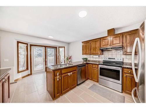 80 Suncastle Crescent Se, Calgary, AB - Indoor Photo Showing Kitchen With Double Sink