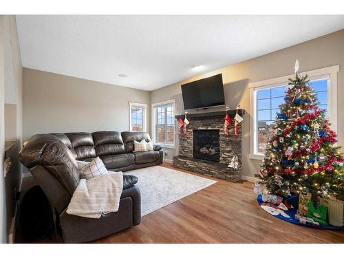 638 Coopers Drive Sw, Airdrie, AB - Indoor Photo Showing Living Room With Fireplace