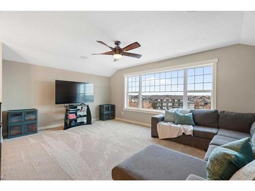 638 Coopers Drive Sw, Airdrie, AB - Indoor Photo Showing Living Room With Fireplace