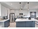 87 Waterford Manor, Chestermere, AB  - Indoor Photo Showing Kitchen With Upgraded Kitchen 