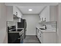 37-195 Manora Place Ne, Calgary, AB  - Indoor Photo Showing Kitchen With Double Sink 