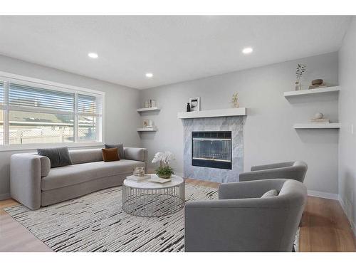 103 Scandia Bay Nw, Calgary, AB - Indoor Photo Showing Living Room With Fireplace