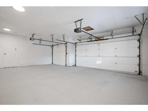 103 Scandia Bay Nw, Calgary, AB - Indoor Photo Showing Garage