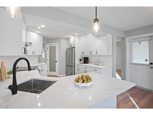 103 Scandia Bay Nw, Calgary, AB - Indoor Photo Showing Kitchen With Double Sink