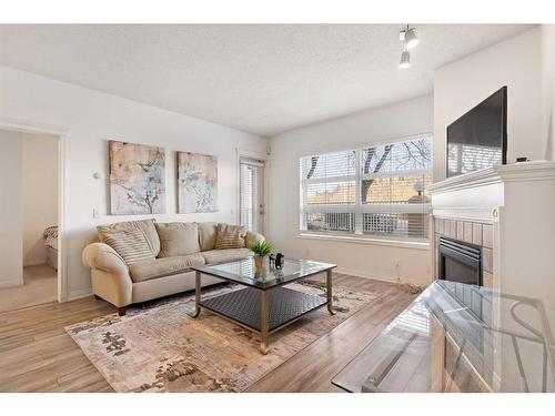 151-333 Riverfront Avenue Se, Calgary, AB - Indoor Photo Showing Living Room With Fireplace