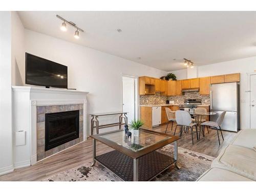 151-333 Riverfront Avenue Se, Calgary, AB - Indoor Photo Showing Living Room With Fireplace