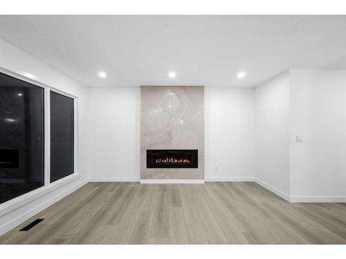 7915 Huntington Street Ne, Calgary, AB - Indoor With Fireplace