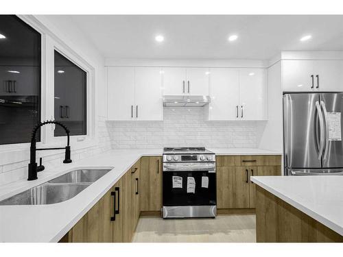 7915 Huntington Street Ne, Calgary, AB - Indoor Photo Showing Kitchen With Double Sink With Upgraded Kitchen