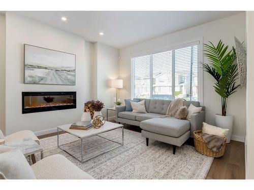 307 Belvedere Drive Se, Calgary, AB - Indoor Photo Showing Living Room With Fireplace