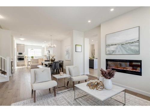 307 Belvedere Drive Se, Calgary, AB - Indoor Photo Showing Living Room With Fireplace