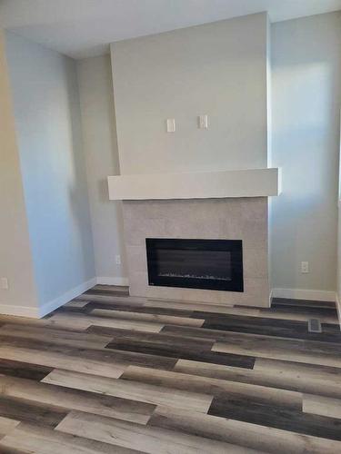 260 Copperleaf Way Se, Calgary, AB - Indoor With Fireplace