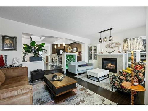 75 Auburn Bay Crescent Se, Calgary, AB - Indoor Photo Showing Living Room With Fireplace