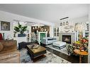 75 Auburn Bay Crescent Se, Calgary, AB  - Indoor Photo Showing Living Room With Fireplace 