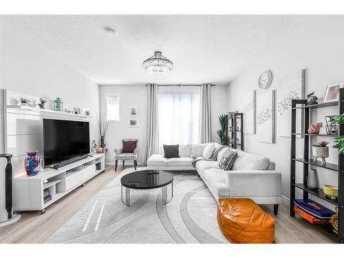 307 Copperstone Manor Se, Calgary, AB - Indoor Photo Showing Living Room