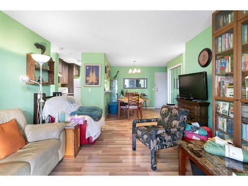 105-55 Arbour Grove Close Nw, Calgary, AB - Indoor Photo Showing Living Room With Fireplace