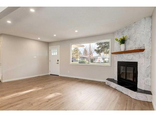 720 Alderwood Place Se, Calgary, AB - Indoor Photo Showing Living Room With Fireplace