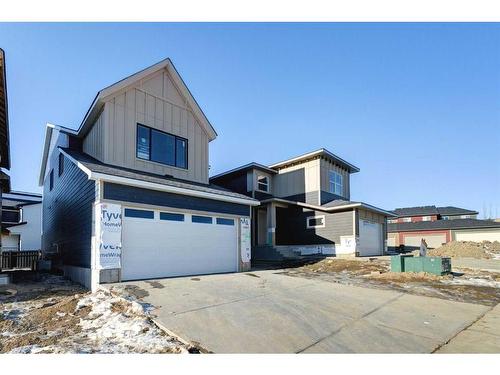 24 Sunvalley View, Cochrane, AB - Outdoor With Facade