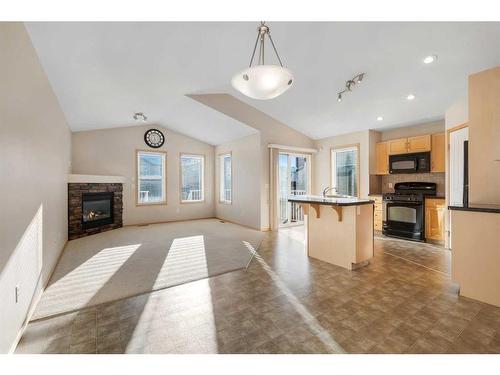 27 Covecreek Place Ne, Calgary, AB - Indoor Photo Showing Other Room With Fireplace