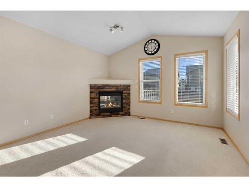 27 Covecreek Place Ne, Calgary, AB - Indoor Photo Showing Living Room With Fireplace