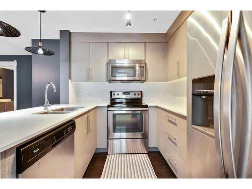 2108-302 Skyview Ranch Drive Ne, Calgary, AB - Indoor Photo Showing Kitchen With Stainless Steel Kitchen With Double Sink With Upgraded Kitchen