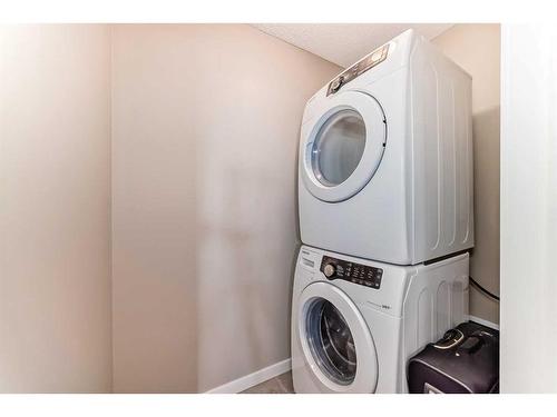 703-10 Auburn Bay Avenue Se, Calgary, AB - Indoor Photo Showing Laundry Room