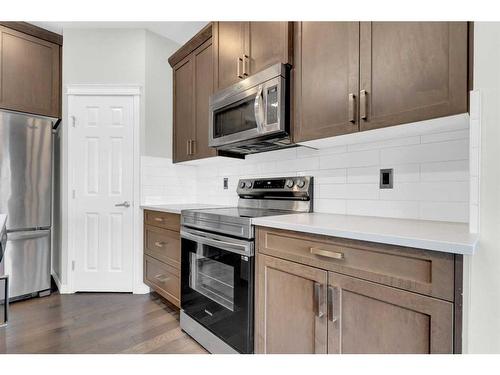 217 Hillcrest Drive Sw, Airdrie, AB - Indoor Photo Showing Kitchen With Stainless Steel Kitchen