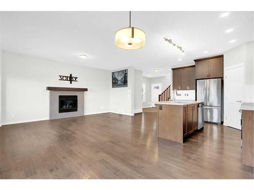 217 Hillcrest Drive Sw, Airdrie, AB - Indoor With Fireplace