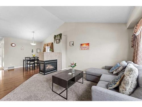 17 Martinvalley Crescent Ne, Calgary, AB - Indoor Photo Showing Living Room With Fireplace