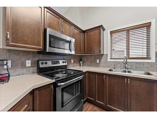 17 Martinvalley Crescent Ne, Calgary, AB - Indoor Photo Showing Kitchen With Double Sink