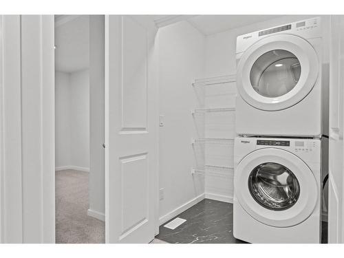 149 Belmont Way Sw, Calgary, AB - Indoor Photo Showing Laundry Room