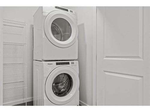 149 Belmont Way Sw, Calgary, AB - Indoor Photo Showing Laundry Room